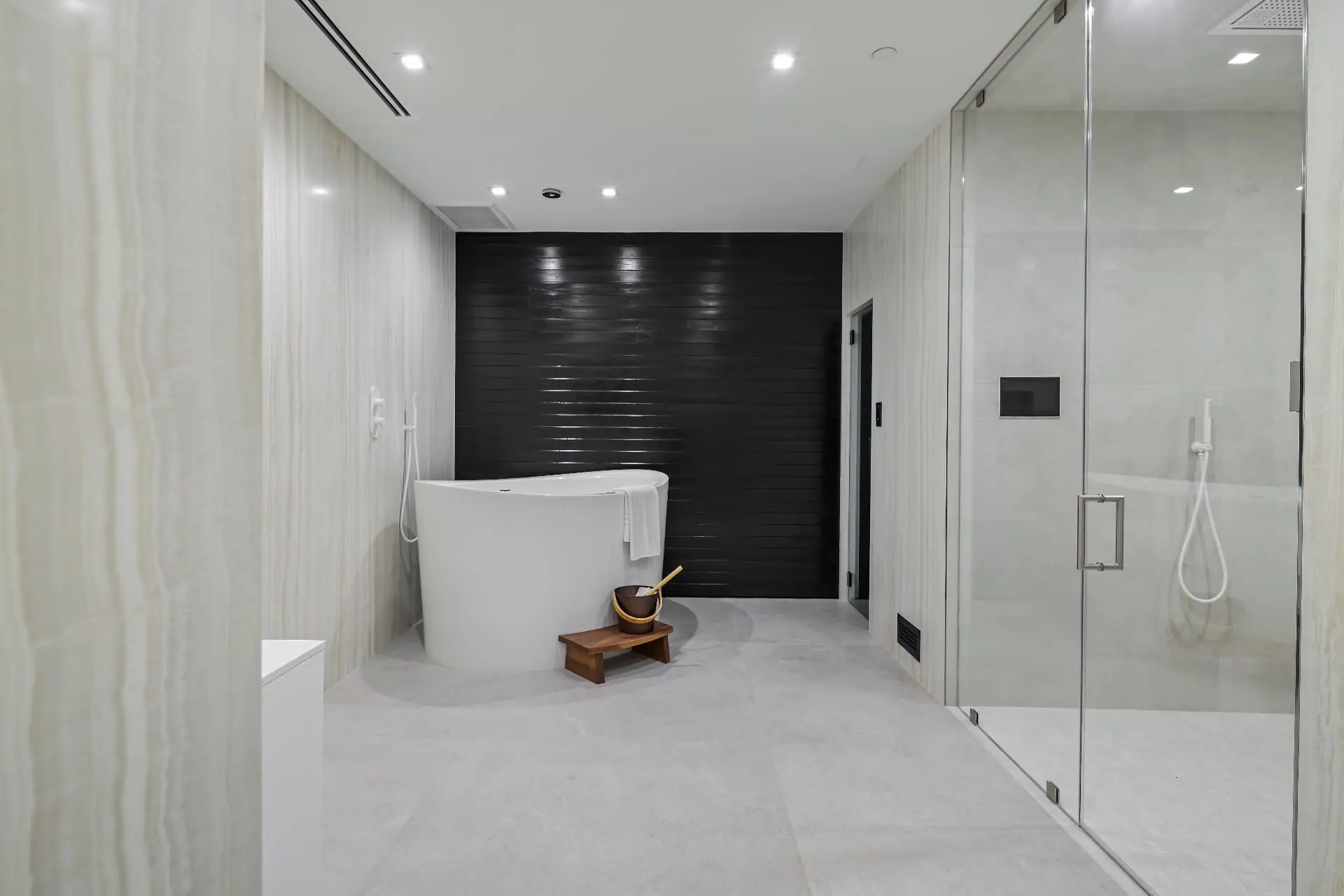 Spa bathroom remodeled with natural stone and warm finishes